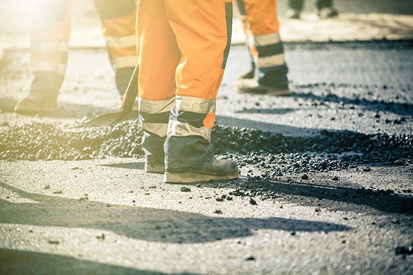 Teamwork, Group of workers on a road construction, team of people at work