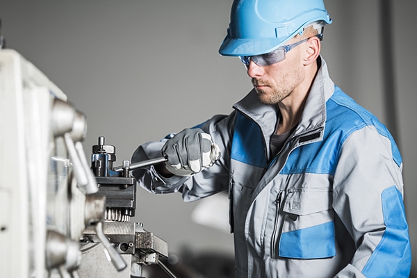 Caucasian Industrial Worker. Metalworking Industry. Lathe Operator.